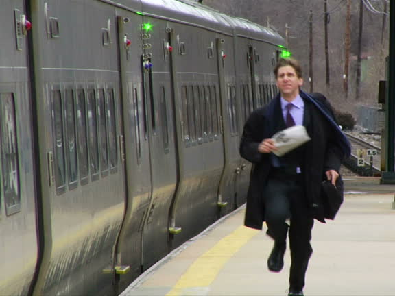 man chasing train